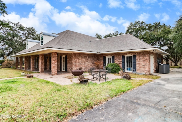 back of property featuring a patio, a yard, and cooling unit