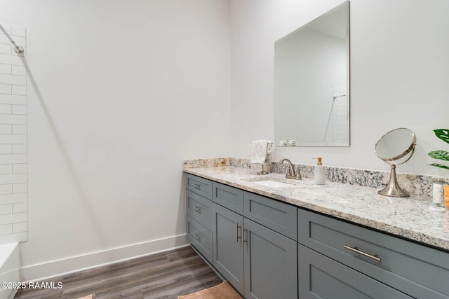 bathroom with hardwood / wood-style floors and vanity