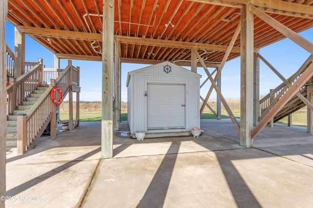 view of patio / terrace featuring a storage shed