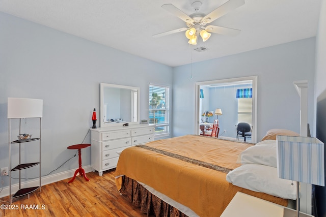 bedroom with ceiling fan and light wood-type flooring