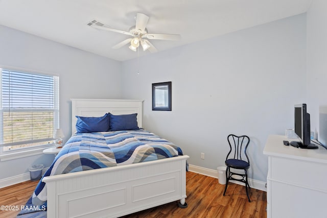 bedroom featuring dark hardwood / wood-style floors and ceiling fan