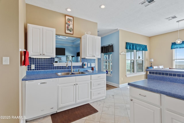 kitchen featuring white cabinetry, dishwasher, and sink