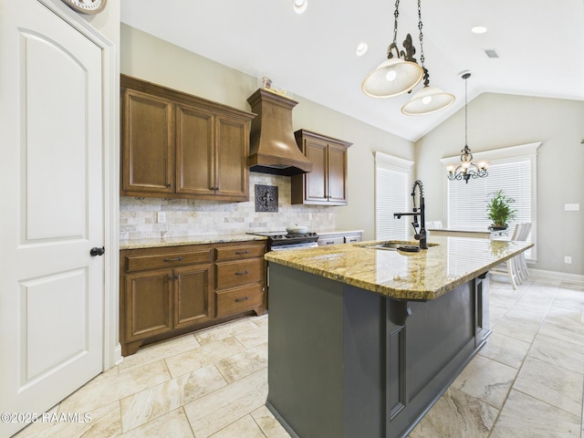 208 Rue De Frejus, Broussard, LA 70518 - kitchen with premium range hood, a sink, vaulted ceiling, decorative backsplash, and light stone countertops