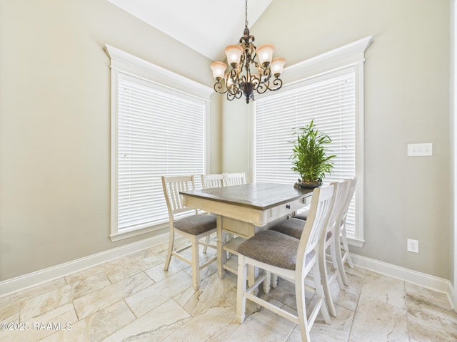 208 Rue De Frejus, Broussard, LA 70518 - dining space featuring a chandelier, baseboards, lofted ceiling, and healthy amount of natural light