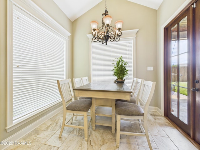 208 Rue De Frejus, Broussard, LA 70518 - dining space with light marble finish flooring, vaulted ceiling, a chandelier, baseboards, and french doors