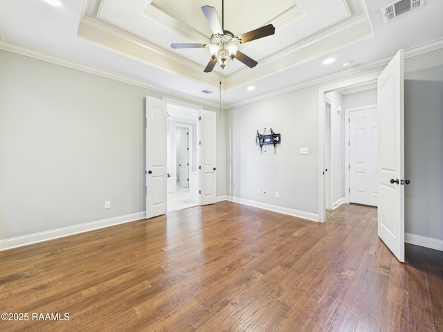 208 Rue De Frejus, Broussard, LA 70518 - spare room with a tray ceiling, ceiling fan, ornamental molding, wood finished floors, and recessed lighting