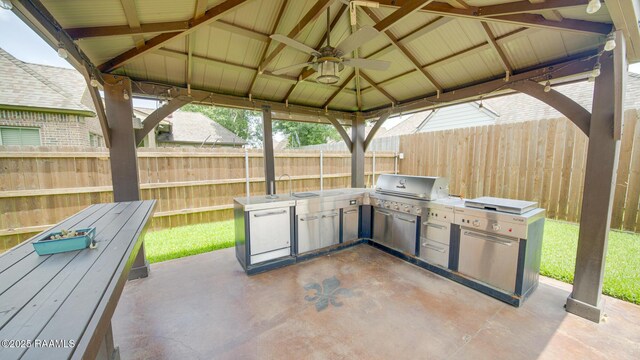208 Rue De Frejus, Broussard, LA 70518 - fenced backyard featuring a gazebo, a patio area, a ceiling fan, and a sink