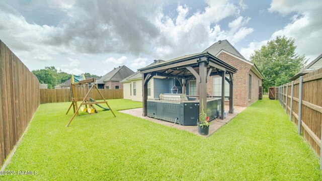 208 Rue De Frejus, Broussard, LA 70518 - back of property with a gazebo, a patio, brick siding, a playground, and a shingled roof