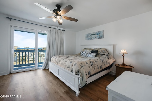 bedroom with ceiling fan, dark hardwood / wood-style flooring, access to outside, and a water view