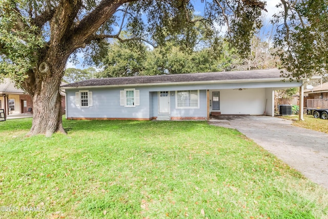 ranch-style house featuring cooling unit, a carport, and a front lawn