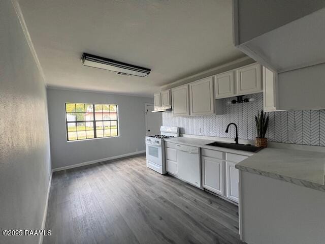 kitchen featuring white cabinetry, light wood-type flooring, white appliances, and sink