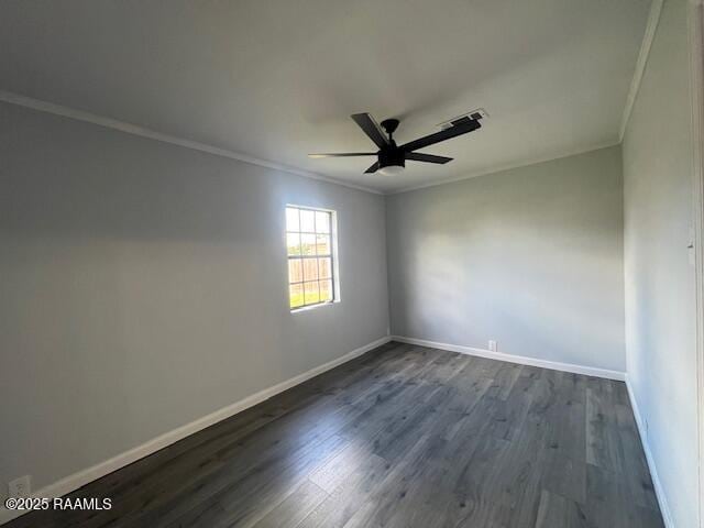 spare room featuring crown molding, ceiling fan, and dark wood-type flooring