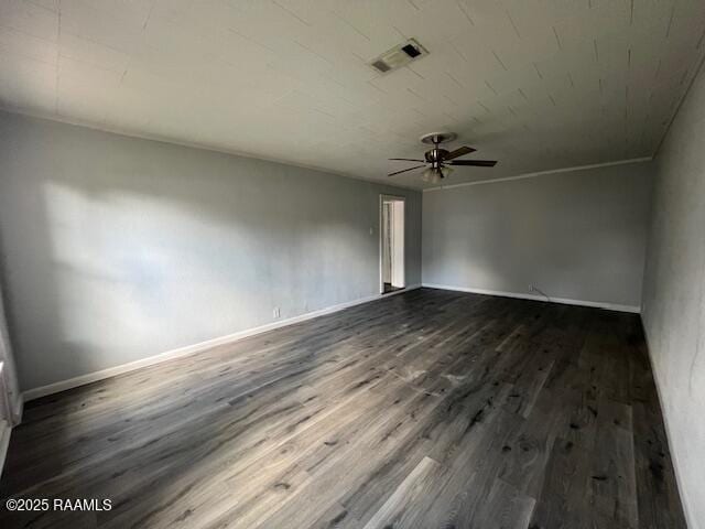 empty room featuring dark hardwood / wood-style floors and ceiling fan