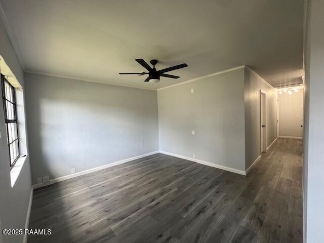 empty room featuring ceiling fan, dark hardwood / wood-style flooring, and crown molding