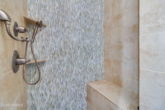 details featuring a tile shower