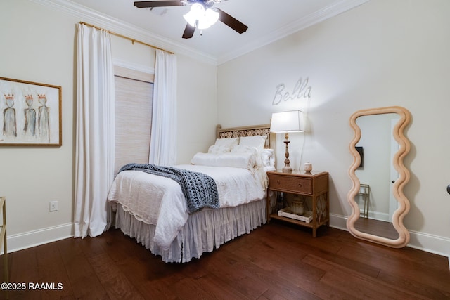 bedroom featuring dark hardwood / wood-style flooring, ceiling fan, and crown molding