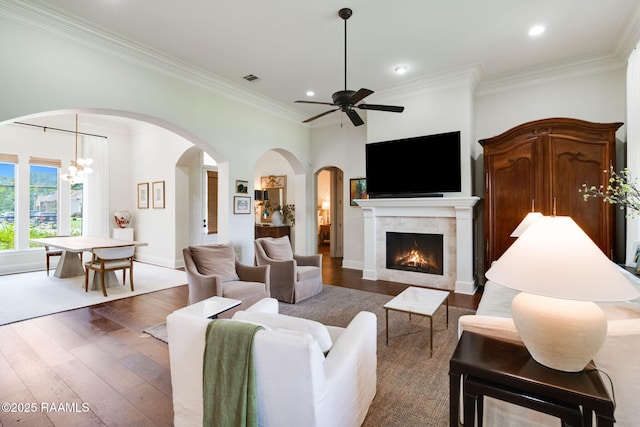 living room with ornamental molding and dark hardwood / wood-style flooring