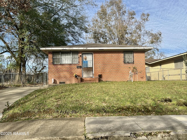 bungalow-style house with a front yard