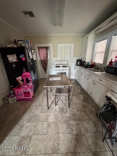 kitchen featuring ornamental molding, sink, fridge with ice dispenser, white cabinets, and white range with gas stovetop