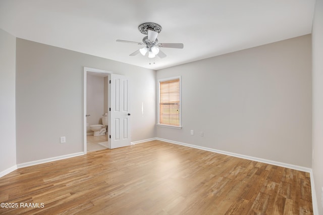 empty room featuring light wood-type flooring and ceiling fan