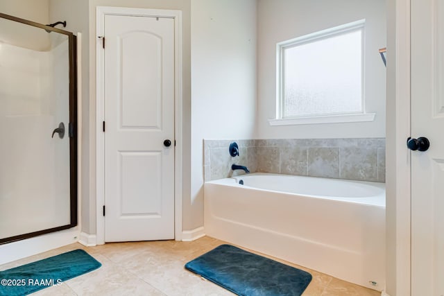 bathroom featuring separate shower and tub and tile patterned floors