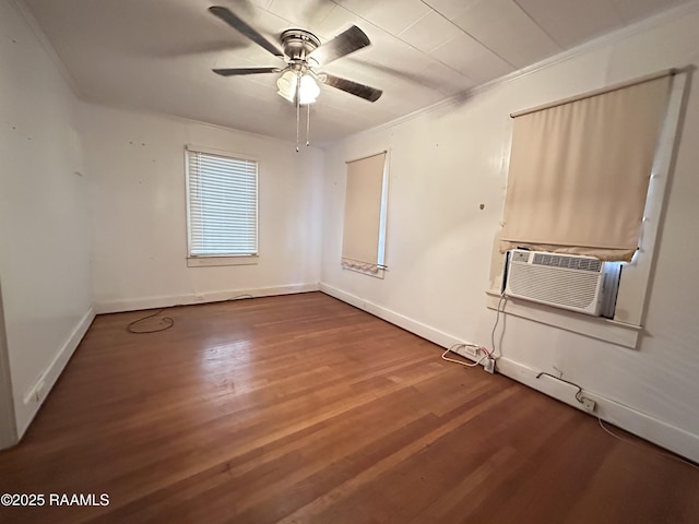 spare room featuring cooling unit, ceiling fan, hardwood / wood-style flooring, and crown molding