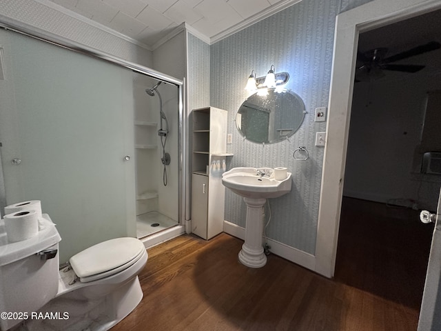 bathroom with ornamental molding, walk in shower, and hardwood / wood-style flooring