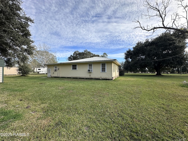 view of home's exterior with a lawn