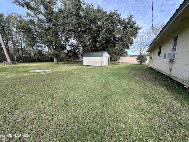 view of yard with cooling unit and a shed