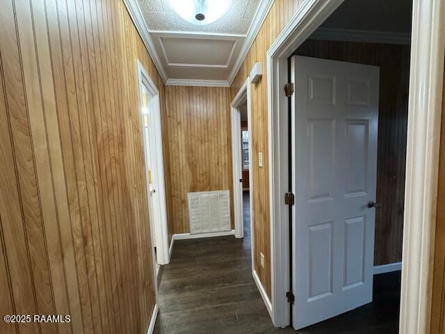 hallway with wooden walls and ornamental molding