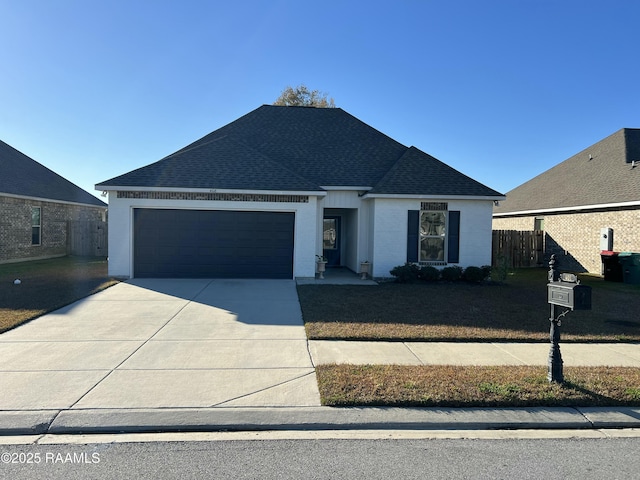 view of front of property with a garage