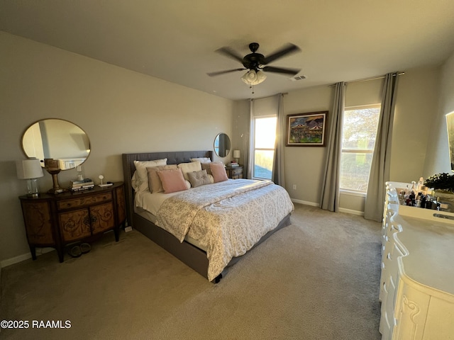 bedroom featuring ceiling fan and carpet