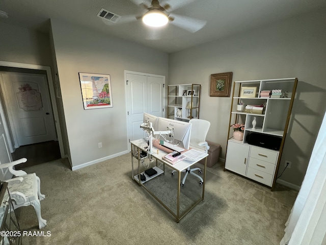 office area featuring ceiling fan and light colored carpet