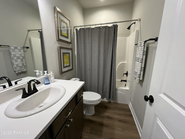 full bathroom featuring wood-type flooring, toilet, vanity, and shower / tub combo with curtain