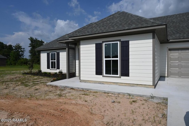 view of home's exterior with a garage