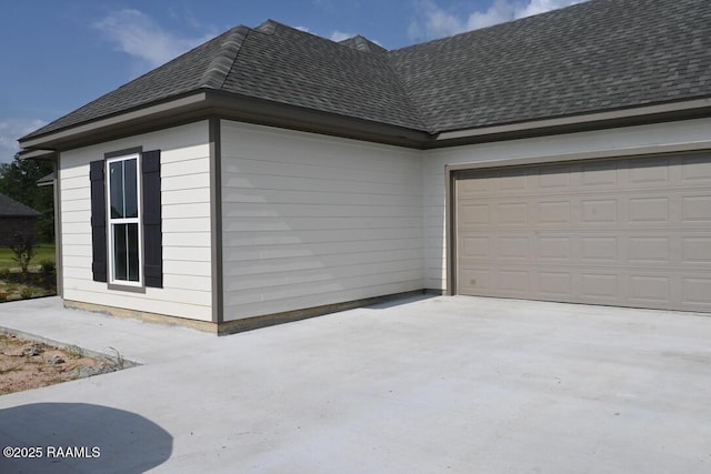 view of property exterior with a garage