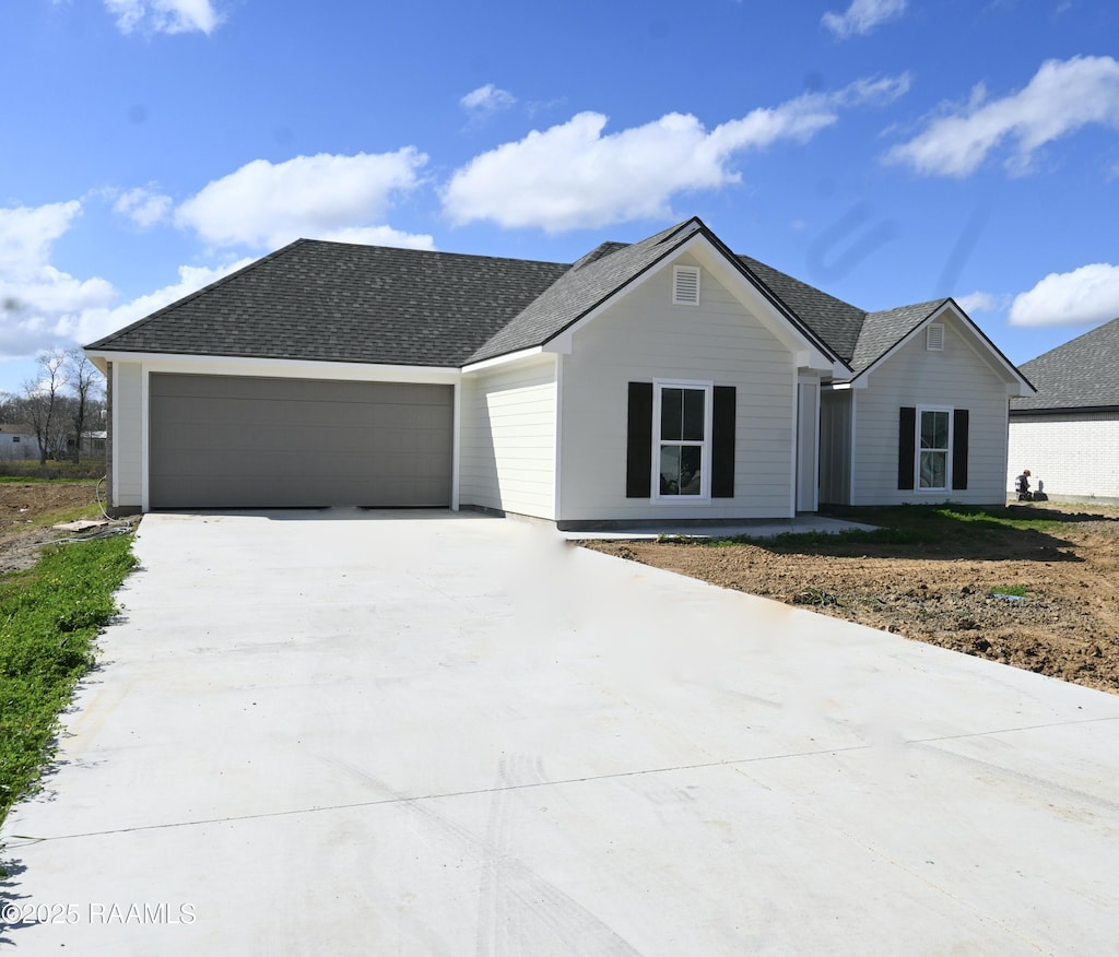 single story home with a garage