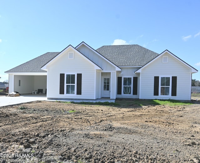 view of front of property featuring a carport