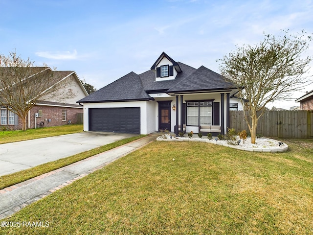 view of front of house with a garage and a front yard