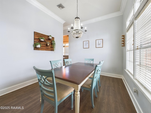 dining space with crown molding, plenty of natural light, dark hardwood / wood-style floors, and a notable chandelier