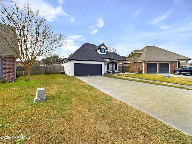 view of front of home featuring a garage and a front lawn