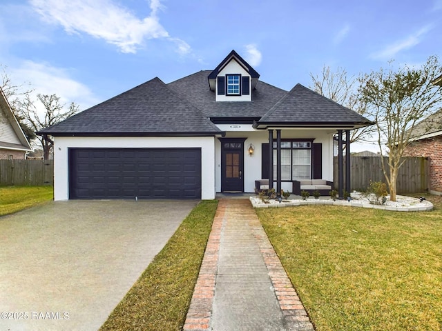 view of front of property with a garage and a front yard