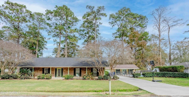 ranch-style home with a front lawn