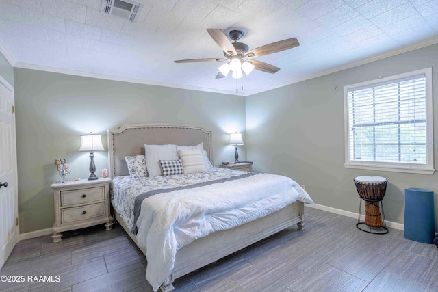 bedroom with ceiling fan and ornamental molding