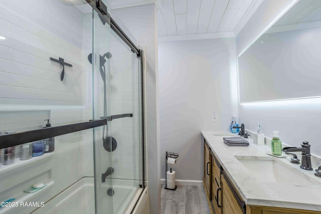 bathroom with shower / bath combination with glass door, hardwood / wood-style flooring, vanity, crown molding, and wood ceiling