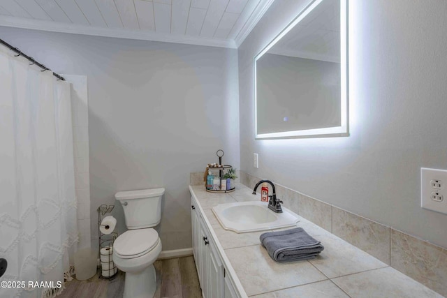 bathroom with wood ceiling, crown molding, vanity, and toilet