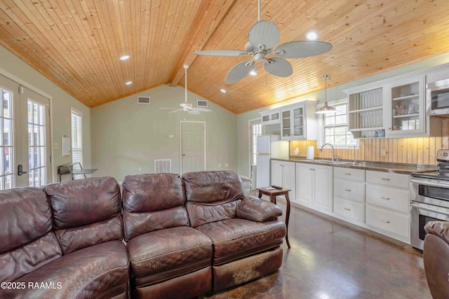 living room with sink, wooden ceiling, french doors, ceiling fan, and lofted ceiling with beams