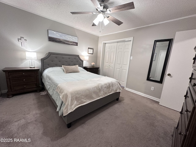 carpeted bedroom featuring ceiling fan, a closet, crown molding, and a textured ceiling