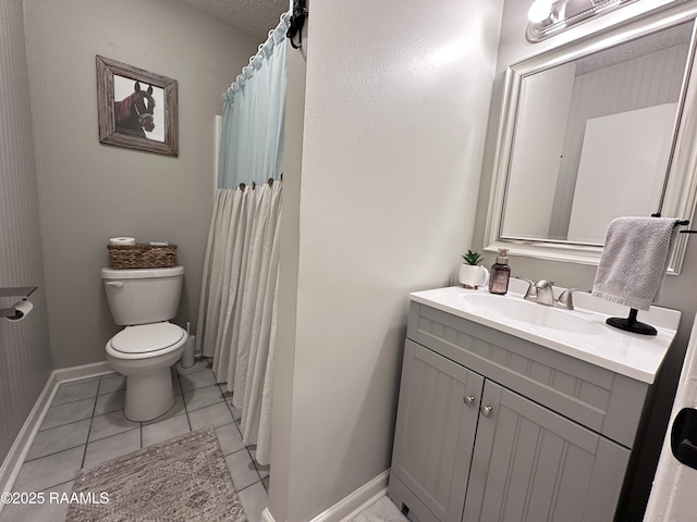 bathroom with a textured ceiling, toilet, vanity, and tile patterned flooring