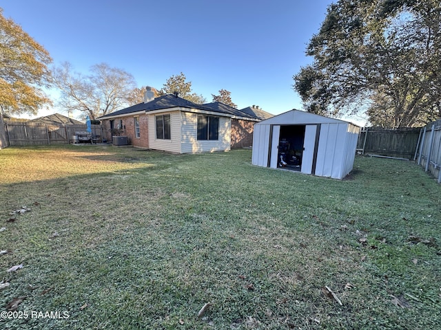 exterior space with central air condition unit and a shed